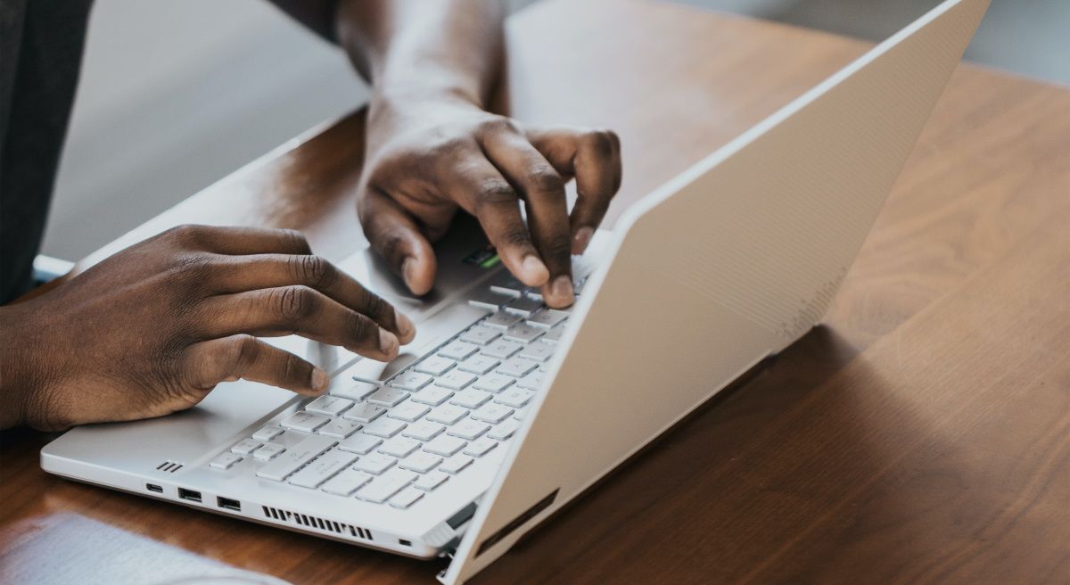 A person using a Windows PC on a desk