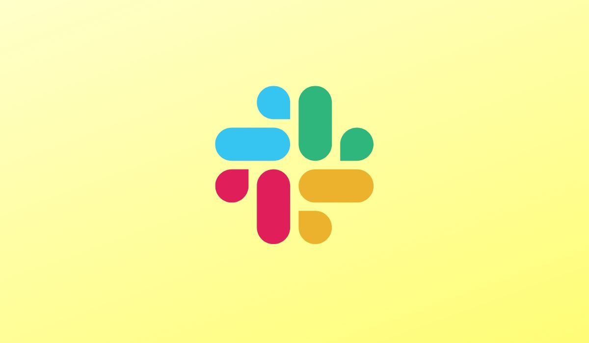 Slack app logo seen on yellow background 