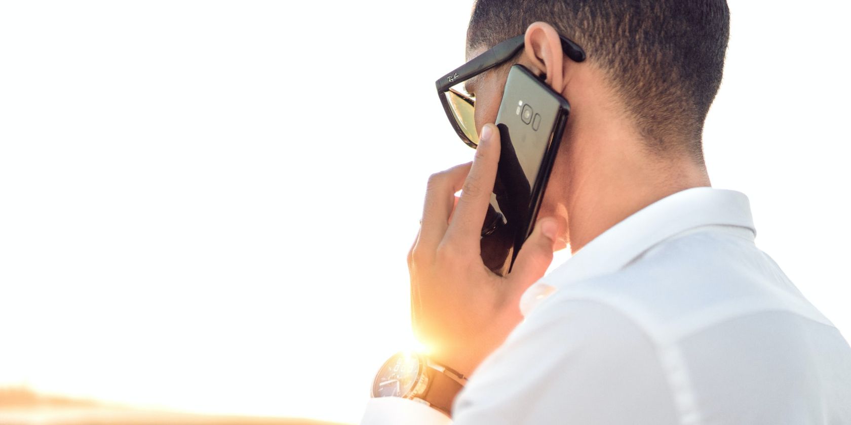 Man Making Phone Call on Smartphone