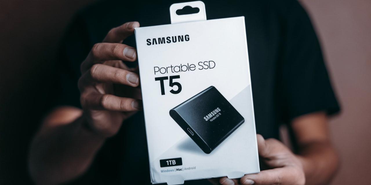 A man holding portable Samsung external SSD