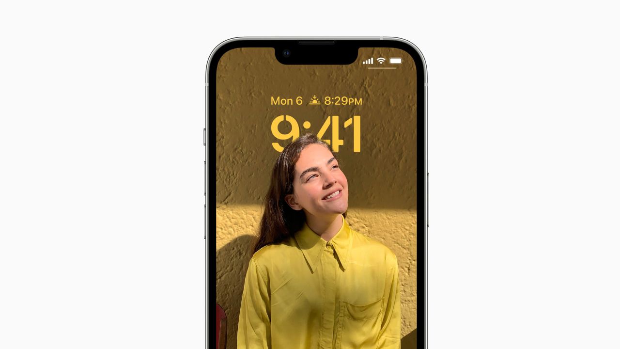 Lock screen Depth Effect on iOS 16 showcasing a woman with clock behind them.