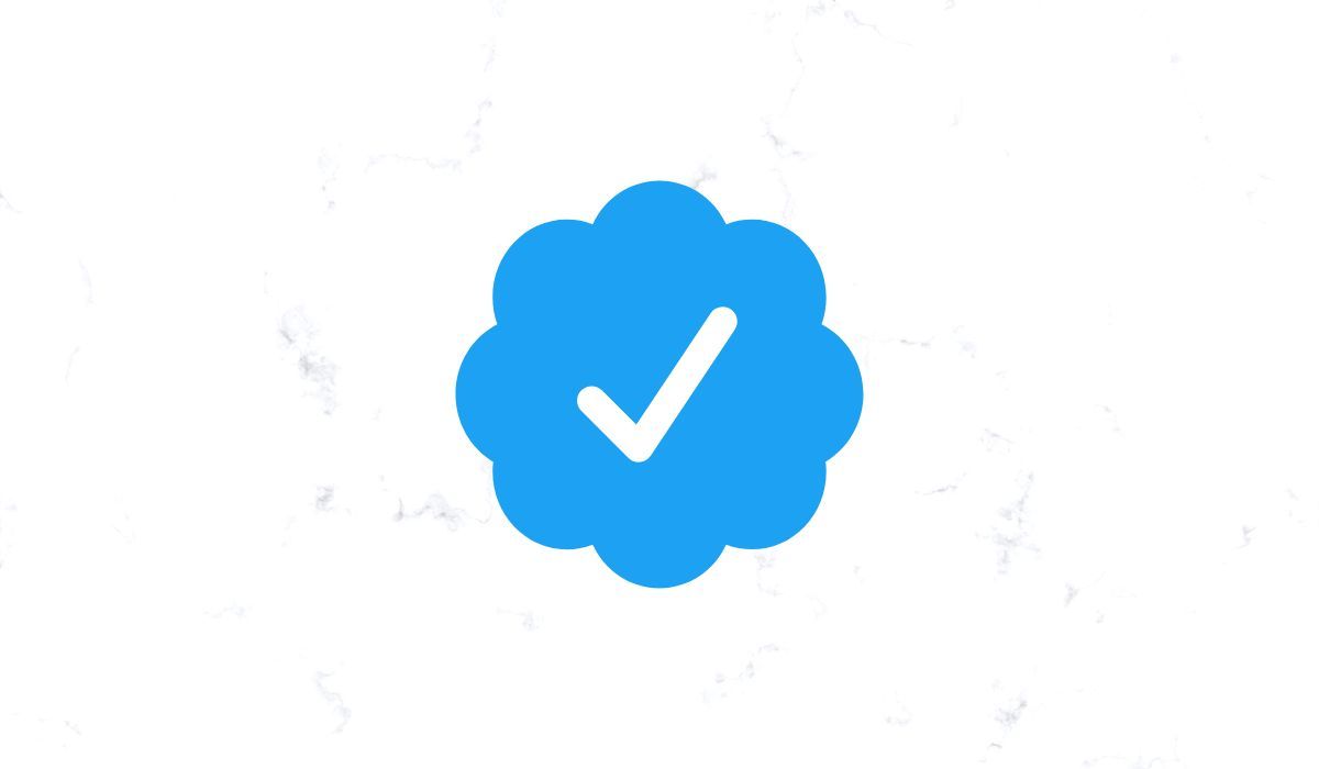 Twitter blue checkmark seen on white background