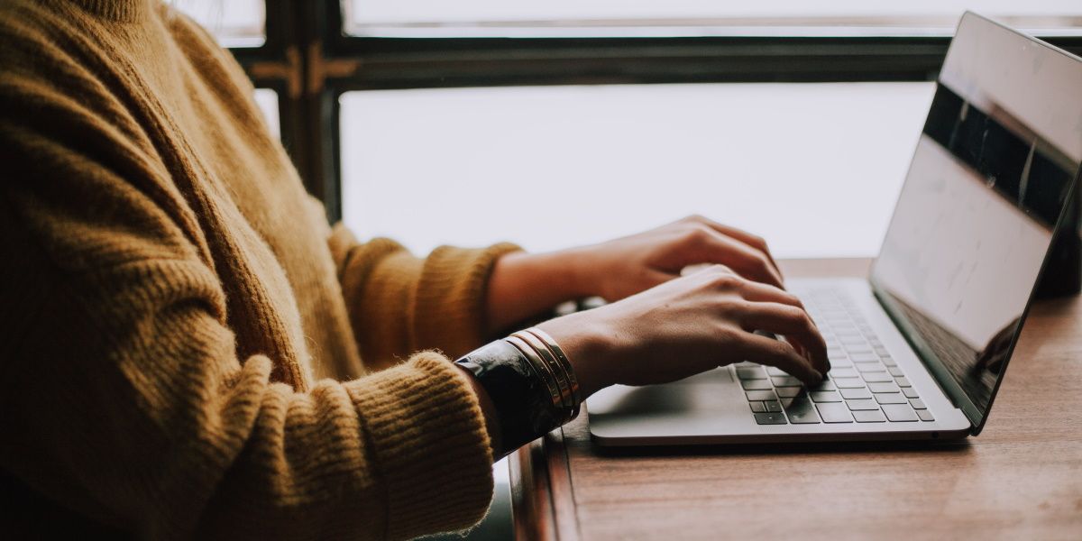 A person using a Windows device on a desk