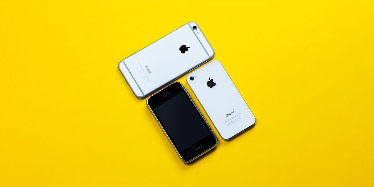 iPhone 6, iPhone 5, and iPhone 3 on yellow surface