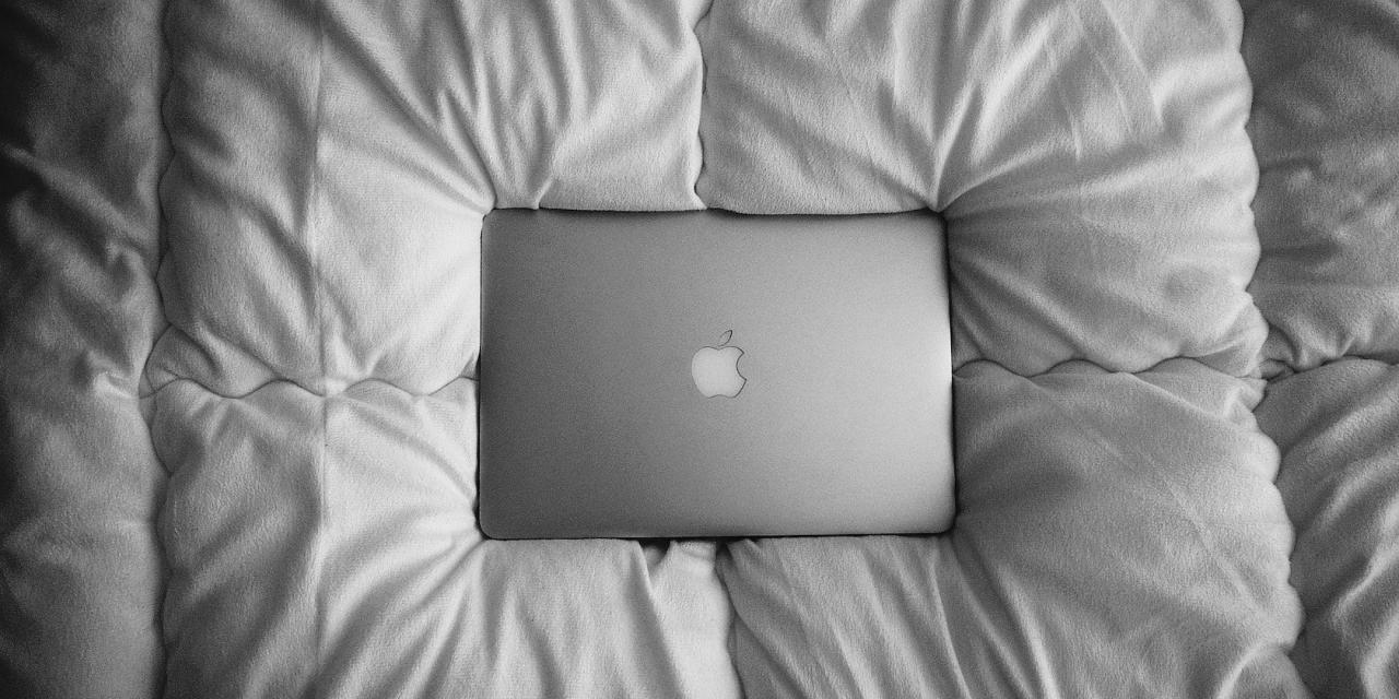 MacBook on a bed