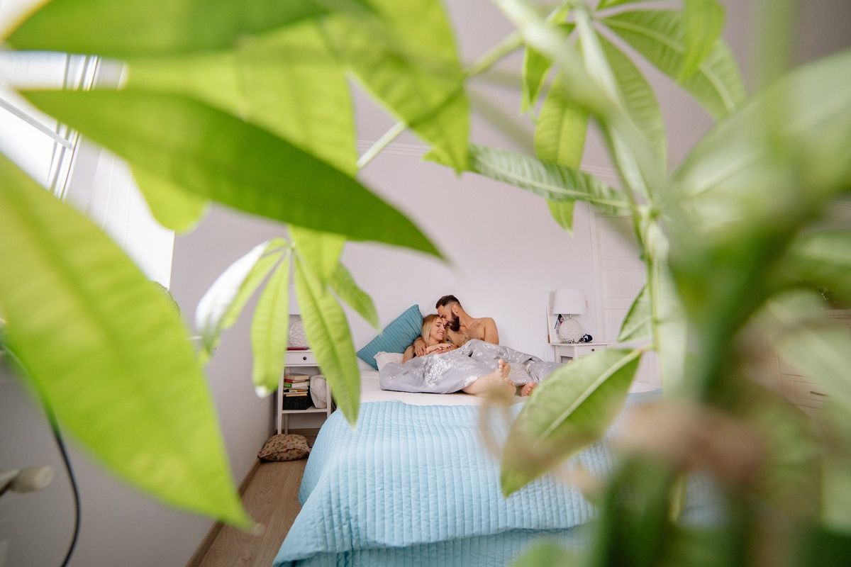 Couple in bed being observed