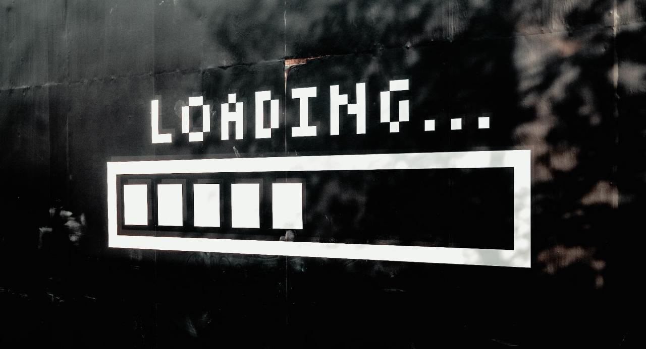 loading text and bar symbol on black exterior wall