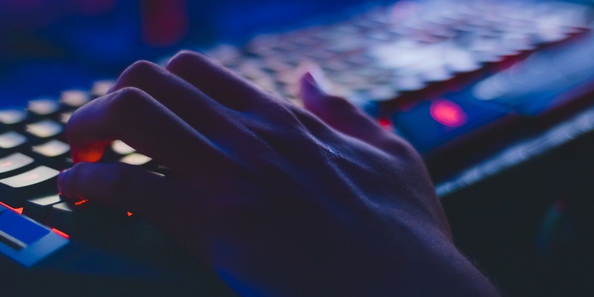 person typing on a gaming keyboard