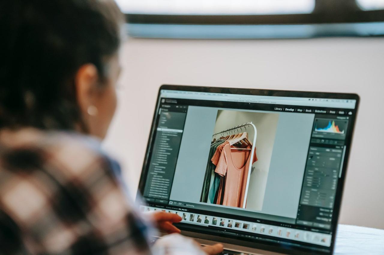 Woman using photo editing software on her laptop