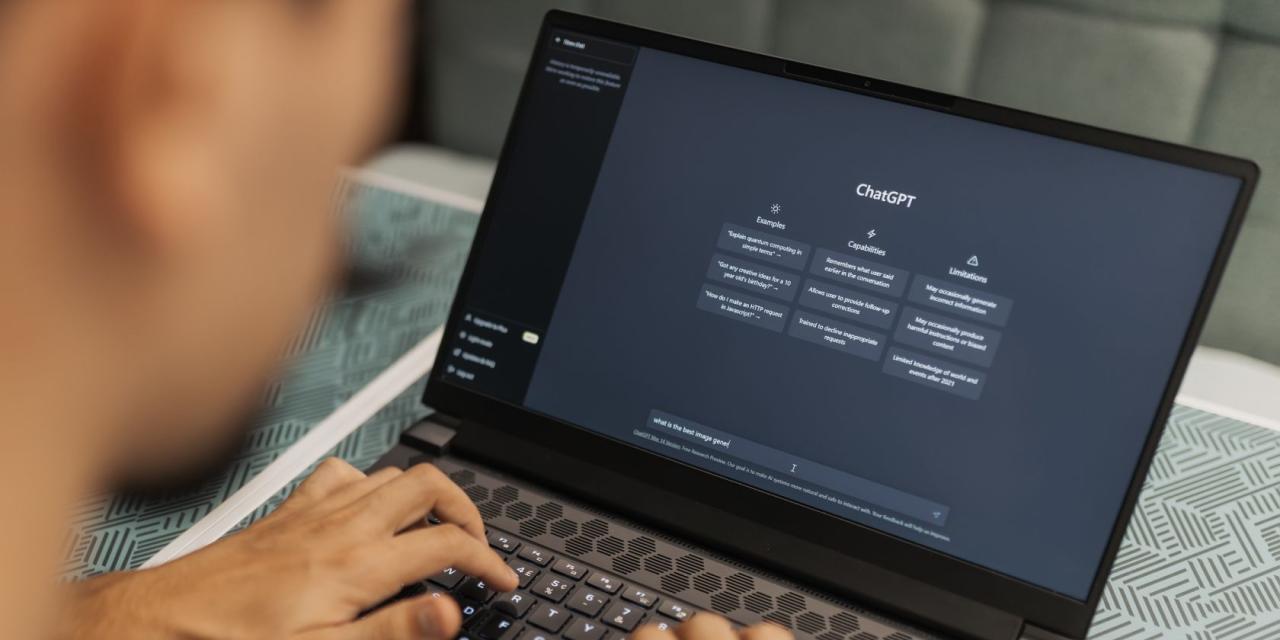 A man uses ChatGPT on his laptop